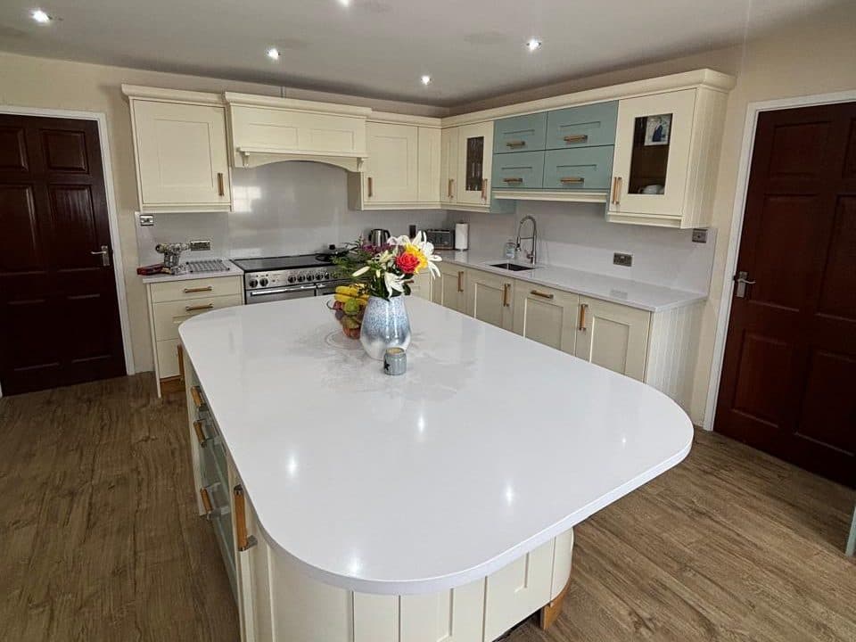 Before: cream and teal shaker kitchen with cream island